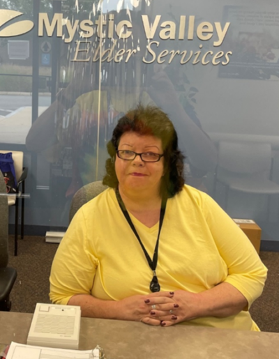 Kim Laughton behind the front desk at MVES
